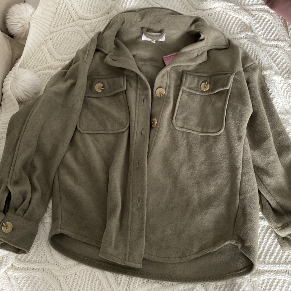 Woman’s olive green sweater jacket.
